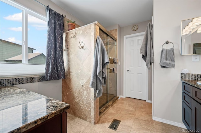 6615 Annanhill Pl, Colorado Springs, CO 80922 - full bathroom featuring vanity, a shower stall, and tile patterned flooring