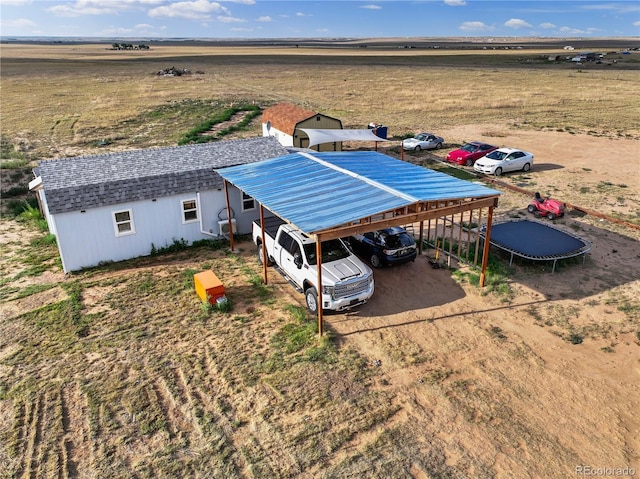 birds eye view of property featuring a rural view