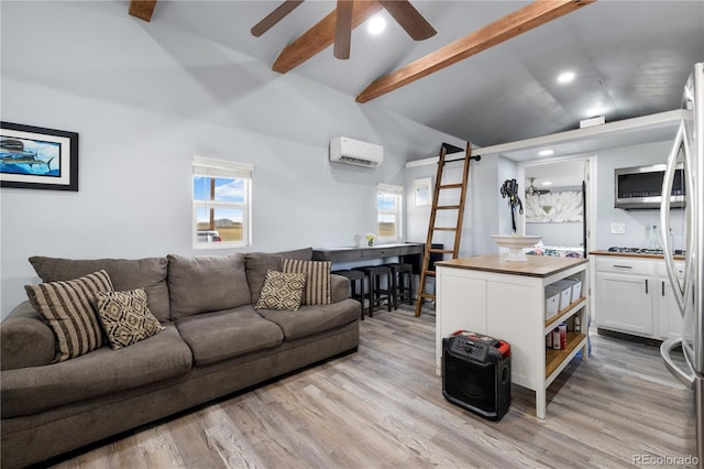 living room featuring ceiling fan, a barn door, a wall unit AC, light wood-style flooring, and beamed ceiling