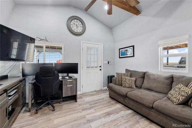 home office featuring light wood finished floors, high vaulted ceiling, and a ceiling fan