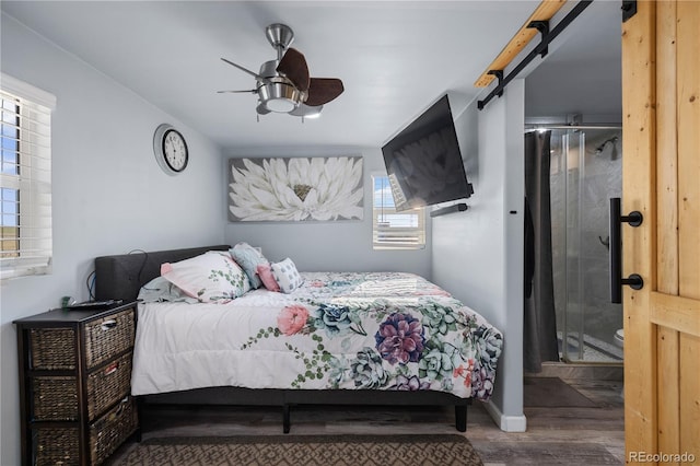 bedroom with wood finished floors, a ceiling fan, and baseboards