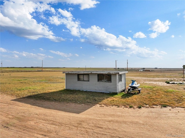 view of outdoor structure featuring a rural view