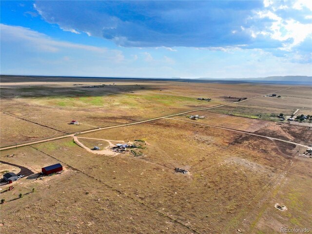 birds eye view of property featuring a rural view