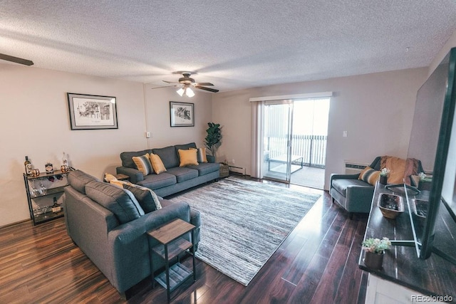 living area featuring a baseboard heating unit, a ceiling fan, a textured ceiling, and wood finished floors