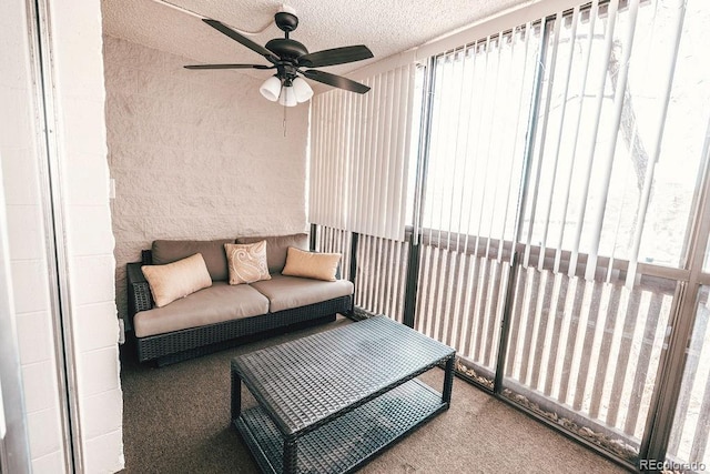 sunroom with ceiling fan