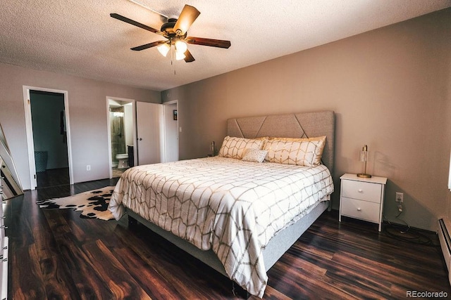 bedroom with a textured ceiling, dark wood-type flooring, a ceiling fan, and ensuite bathroom