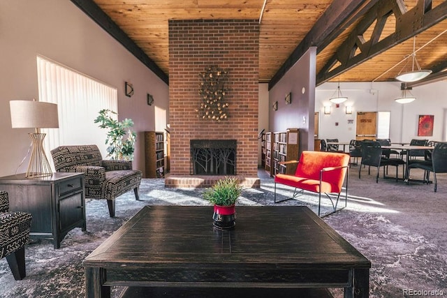 carpeted living area featuring wooden ceiling, a fireplace, and beamed ceiling