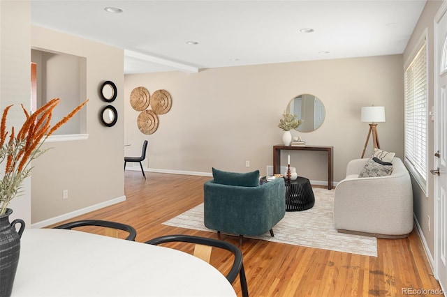 living area with recessed lighting, light wood-style flooring, and baseboards