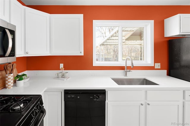 kitchen with a sink, white cabinetry, light countertops, dishwasher, and stainless steel microwave