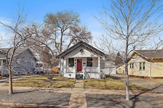 view of front of house with a front lawn and a porch