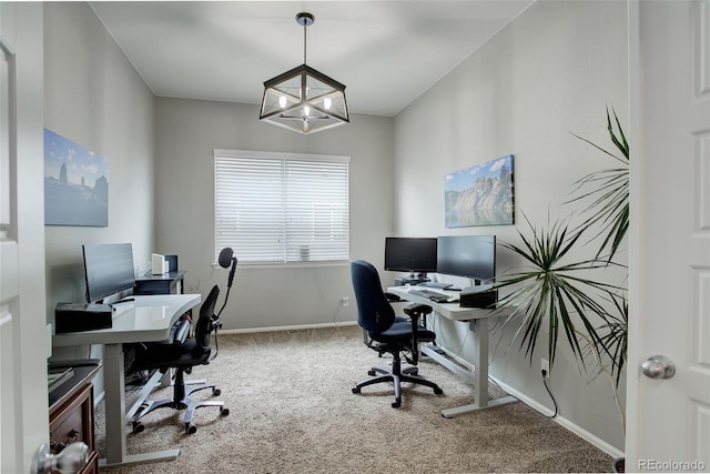 carpeted office space with a notable chandelier and baseboards