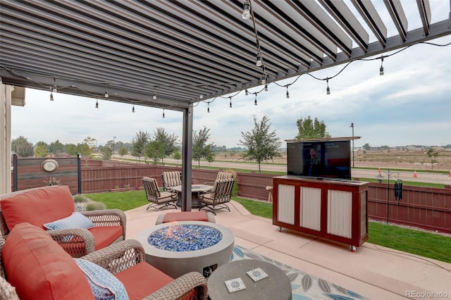 view of patio with a fenced backyard and an outdoor living space with a fire pit