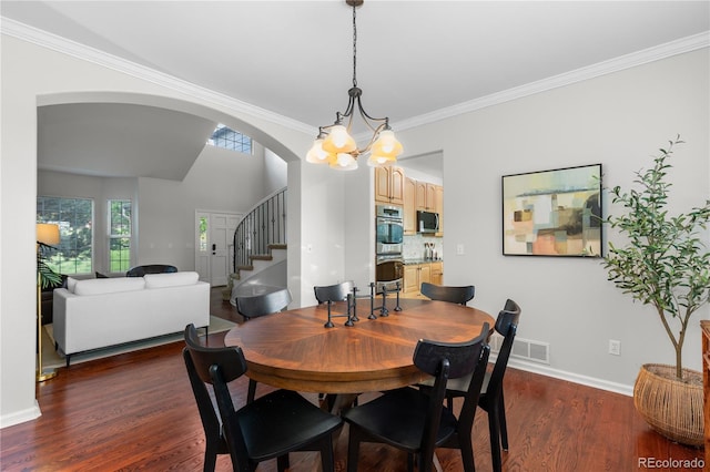 9453 Lark Sparrow Dr, Highlands Ranch, CO 80126 - dining area featuring stairway, dark wood-type flooring, arched walkways, baseboards, and a chandelier