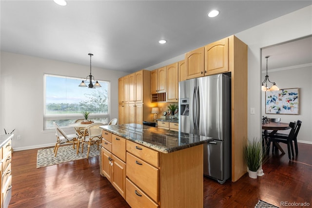 9453 Lark Sparrow Dr, Highlands Ranch, CO 80126 - kitchen with stainless steel fridge with ice dispenser, light brown cabinetry, a kitchen island, baseboards, and dark stone countertops