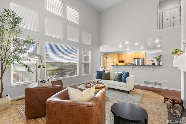 9453 Lark Sparrow Dr, Highlands Ranch, CO 80126 - living room with a towering ceiling, baseboards, and healthy amount of natural light