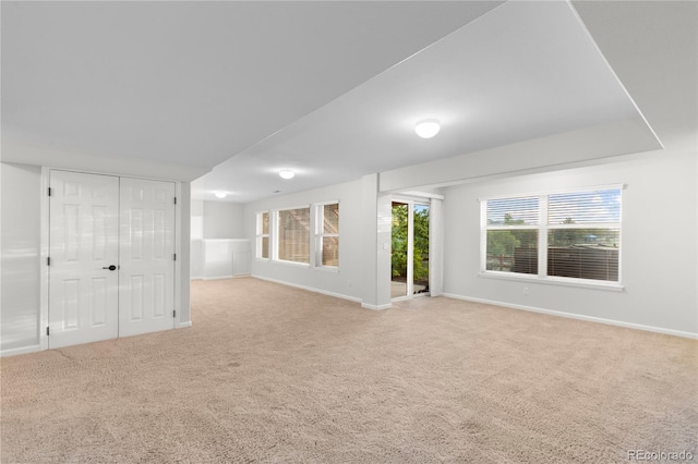 9453 Lark Sparrow Dr, Highlands Ranch, CO 80126 - unfurnished living room featuring carpet flooring and baseboards
