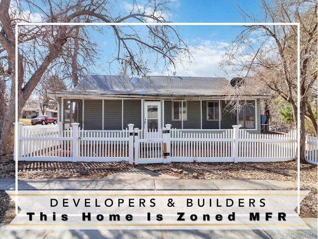 single story home with a fenced front yard and a porch