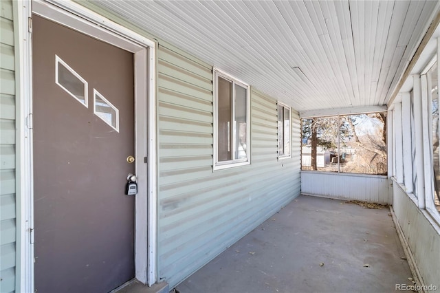 doorway to property featuring covered porch