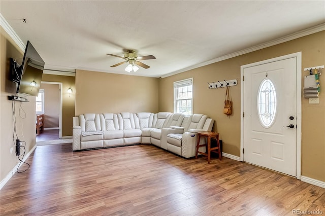 1881 E 95th Ave, Thornton, CO 80229 - living room with baseboards, ornamental molding, light wood finished floors, and ceiling fan