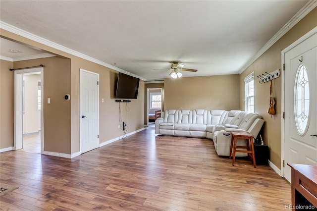 1881 E 95th Ave, Thornton, CO 80229 - living area with baseboards, ornamental molding, light wood finished floors, and ceiling fan