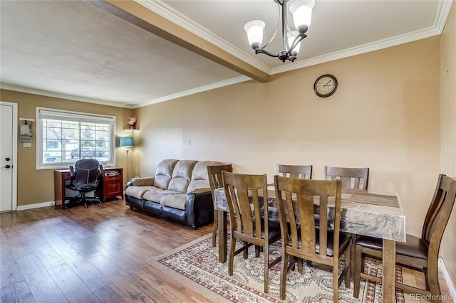 1881 E 95th Ave, Thornton, CO 80229 - dining space featuring wood-type flooring, baseboards, an inviting chandelier, and ornamental molding