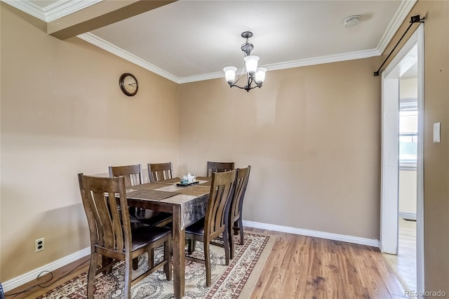 1881 E 95th Ave, Thornton, CO 80229 - dining space with baseboards, an inviting chandelier, ornamental molding, and light wood-style floors