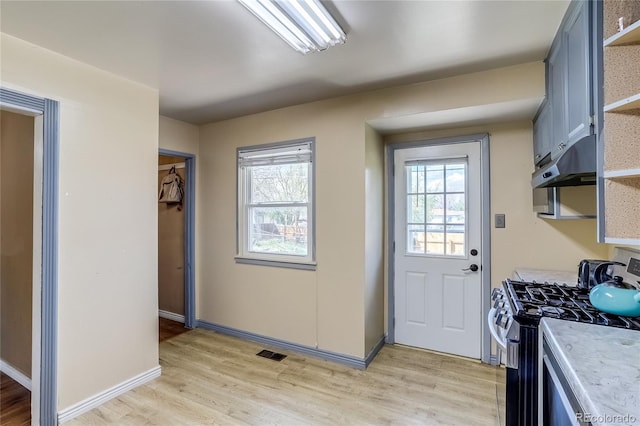 1881 E 95th Ave, Thornton, CO 80229 - doorway to outside featuring baseboards, visible vents, a healthy amount of sunlight, and light wood-style flooring