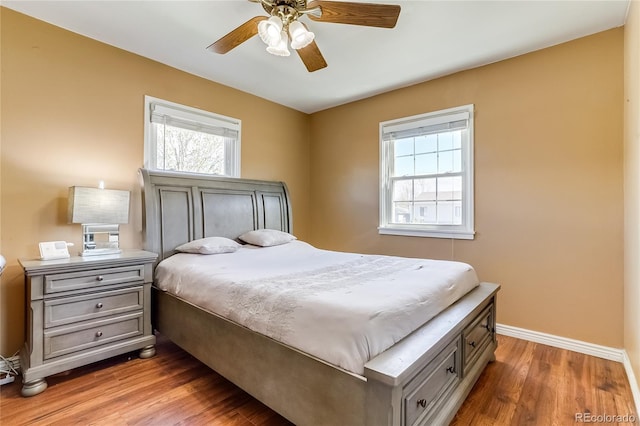 1881 E 95th Ave, Thornton, CO 80229 - bedroom with baseboards, ceiling fan, and wood finished floors