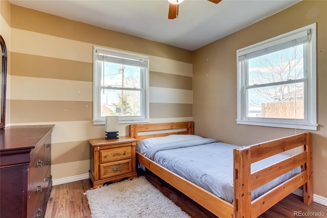 1881 E 95th Ave, Thornton, CO 80229 - bedroom featuring baseboards, a ceiling fan, and wood finished floors