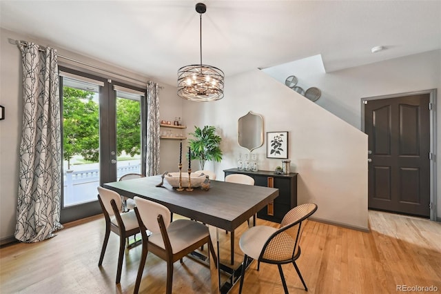 2813 Central Park Blvd, Denver, CO 80238 - dining room with light wood finished floors, baseboards, a chandelier, and french doors