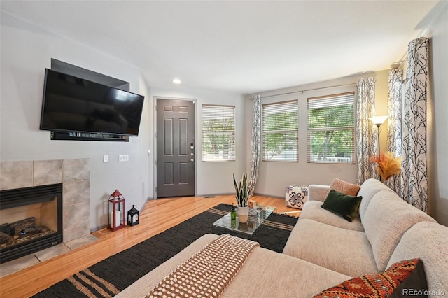 2813 Central Park Blvd, Denver, CO 80238 - living room with wood finished floors, a fireplace, and recessed lighting