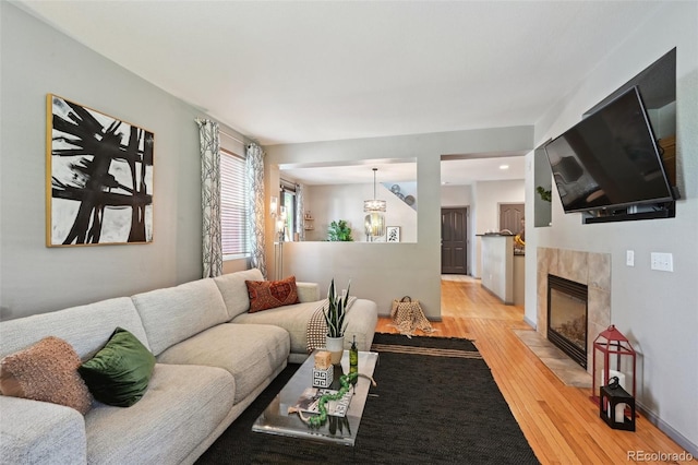 2813 Central Park Blvd, Denver, CO 80238 - living room with light wood-style floors and a tile fireplace