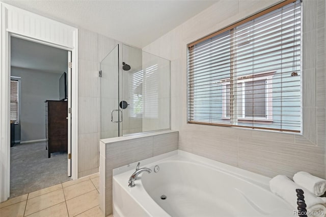 2813 Central Park Blvd, Denver, CO 80238 - full bathroom featuring a garden tub, tile patterned floors, and a shower stall