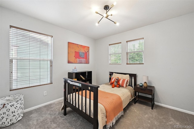 2813 Central Park Blvd, Denver, CO 80238 - carpeted bedroom featuring a chandelier and baseboards