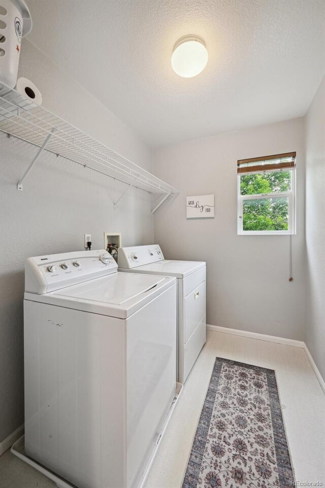 2813 Central Park Blvd, Denver, CO 80238 - laundry room featuring separate washer and dryer and baseboards