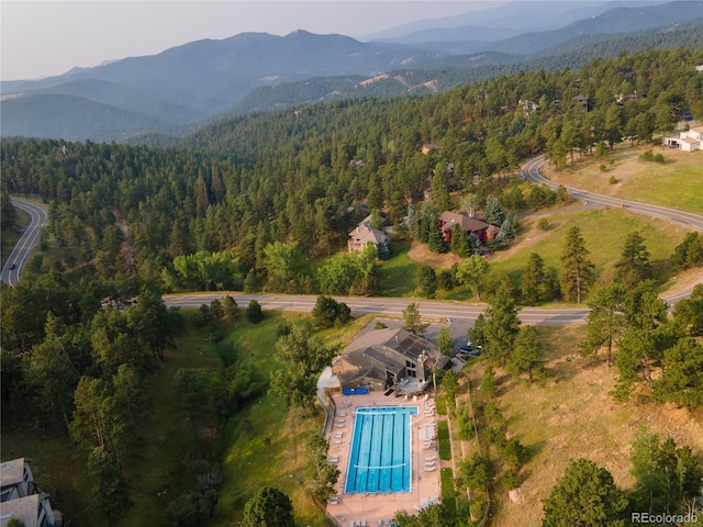 bird's eye view featuring a mountain view and a view of trees