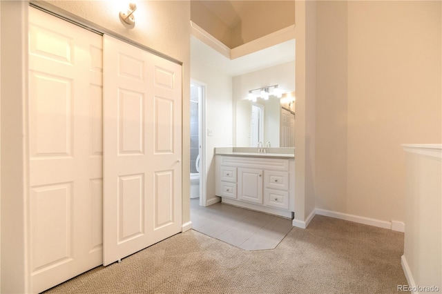 bathroom featuring vanity, toilet, and tile patterned floors