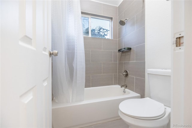 bathroom with shower / tub combo and toilet