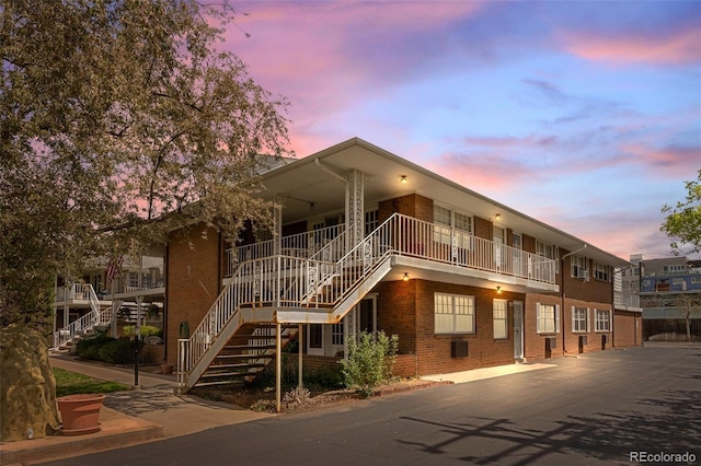 property at dusk with stairway