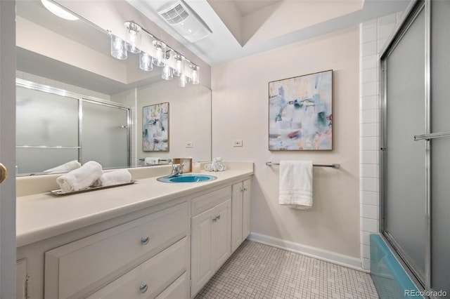 full bathroom with vanity, baseboards, visible vents, and tile patterned flooring