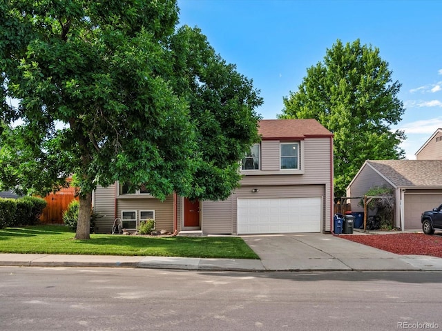 11877 W Bowles Cir, Littleton, CO 80127 - view of front of house with an attached garage and concrete driveway