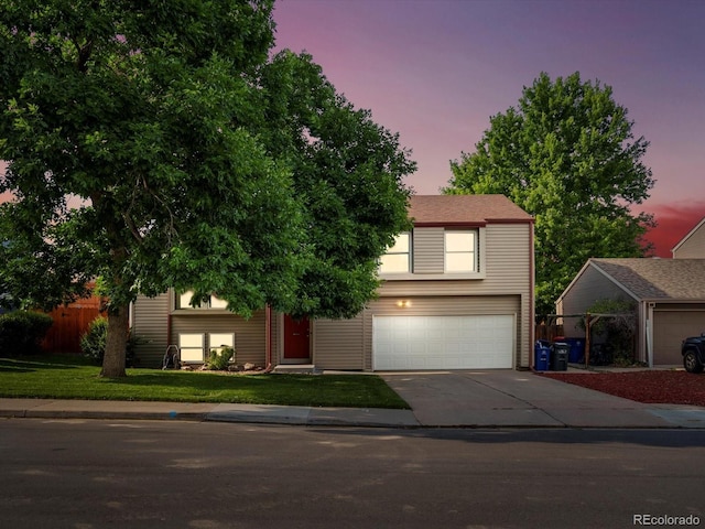 11877 W Bowles Cir, Littleton, CO 80127 - view of front of home featuring a garage and concrete driveway