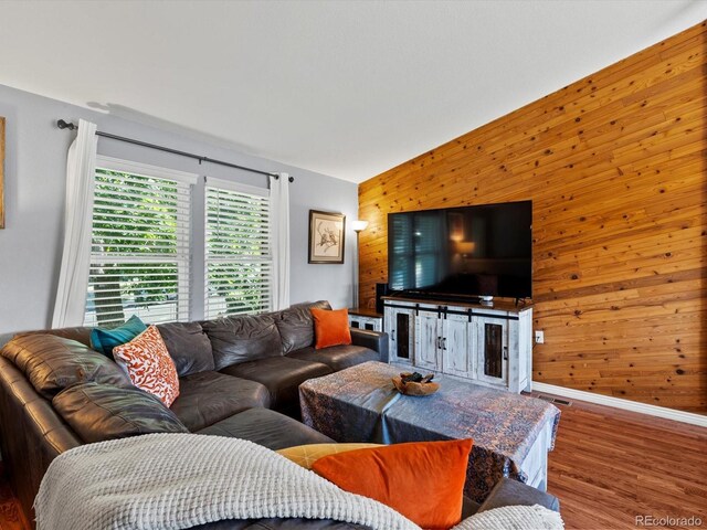 11877 W Bowles Cir, Littleton, CO 80127 - living room with wooden walls and wood finished floors