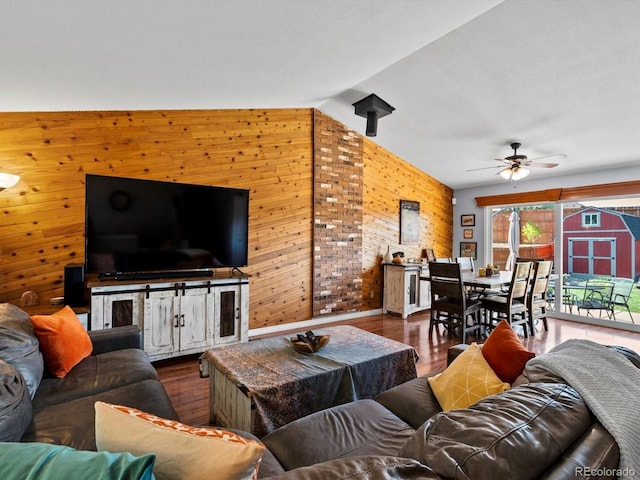 11877 W Bowles Cir, Littleton, CO 80127 - living area with wooden walls, a ceiling fan, and wood finished floors
