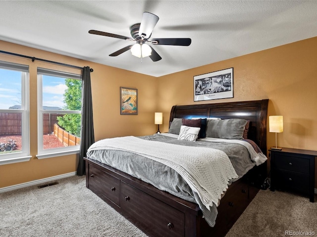 11877 W Bowles Cir, Littleton, CO 80127 - bedroom with carpet floors and ceiling fan