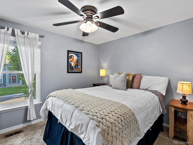 11877 W Bowles Cir, Littleton, CO 80127 - carpeted bedroom with baseboards and ceiling fan