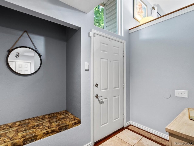 11877 W Bowles Cir, Littleton, CO 80127 - mudroom featuring tile patterned flooring and baseboards