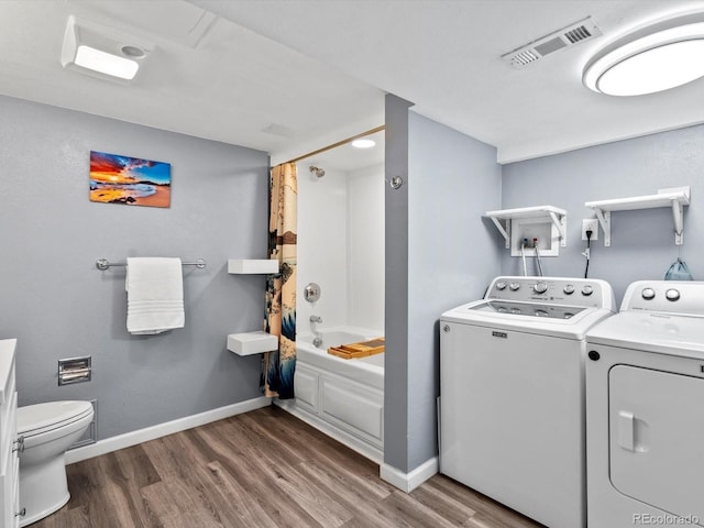 11877 W Bowles Cir, Littleton, CO 80127 - washroom with washer and clothes dryer and wood finished floors