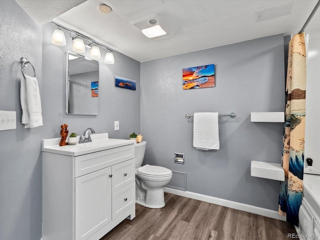 11877 W Bowles Cir, Littleton, CO 80127 - full bathroom featuring wood finished floors and vanity