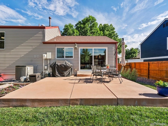 11877 W Bowles Cir, Littleton, CO 80127 - back of house with a patio area